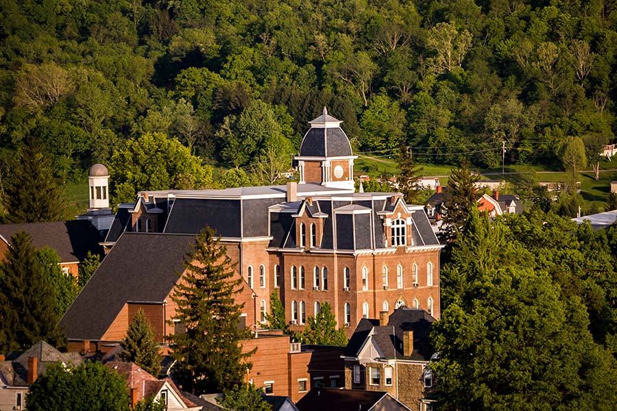 Waynesburg PA - Closeup View of a Historical Building and Homes Surrounded by Green Trees in Waynesburg Pennsylvania